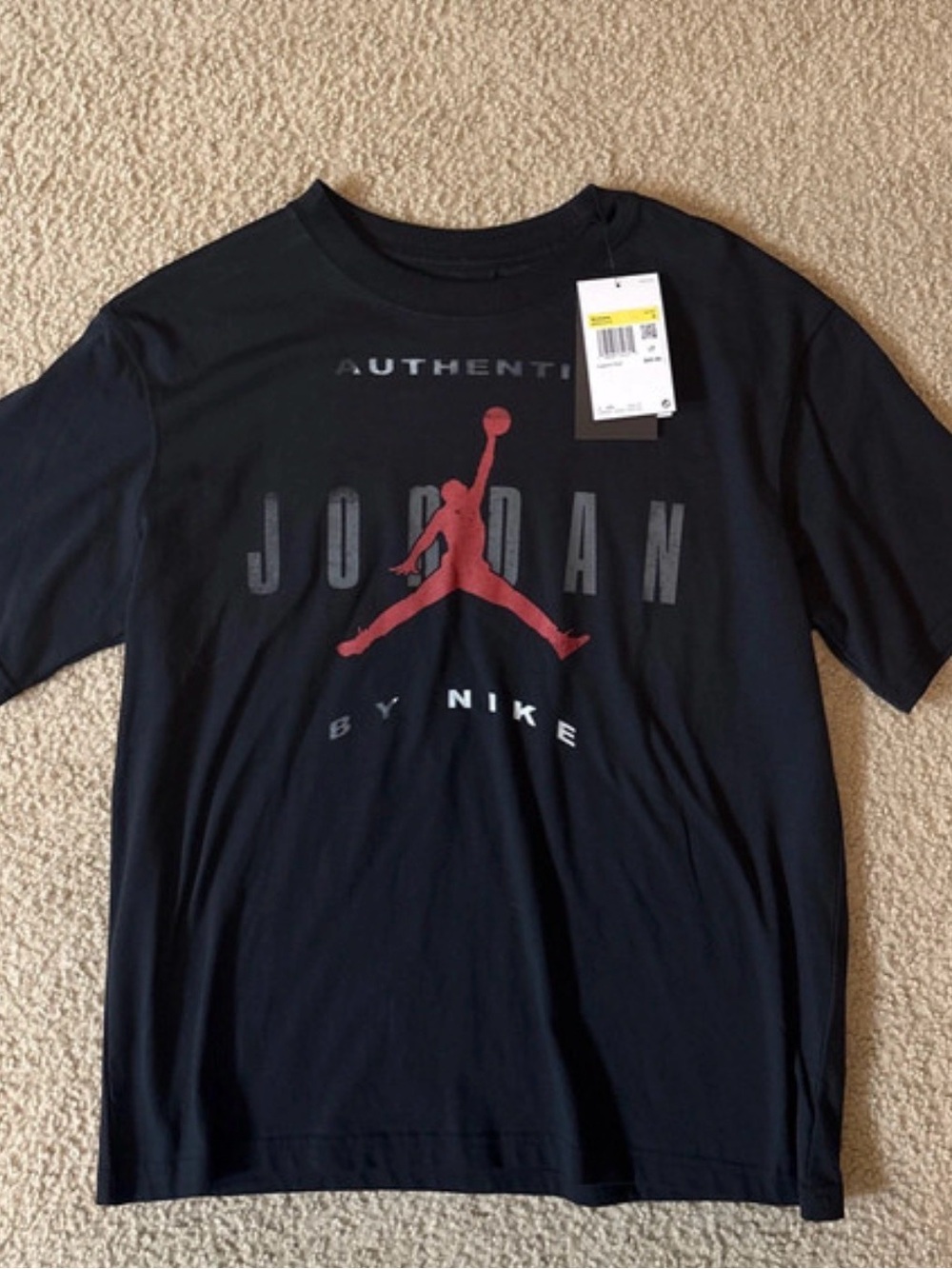 Nike Women’s Black Tee with Red Jumpman Graphic